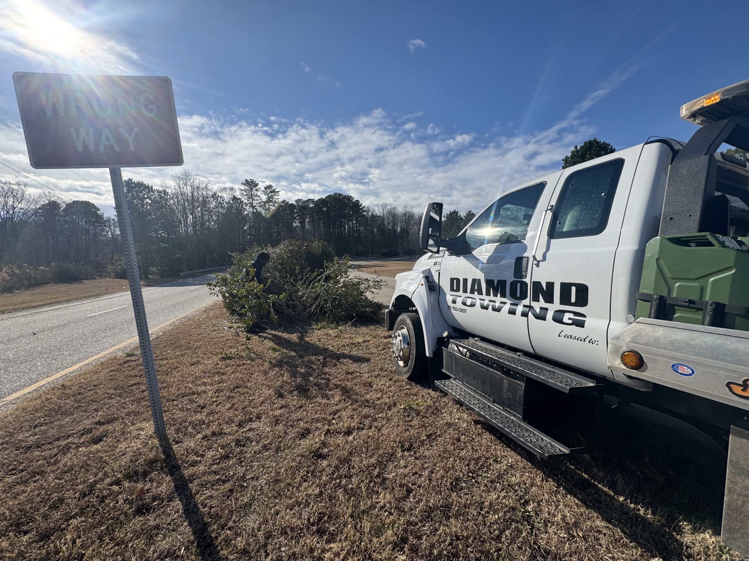 Diamond Towing truck on a rural roadside service call